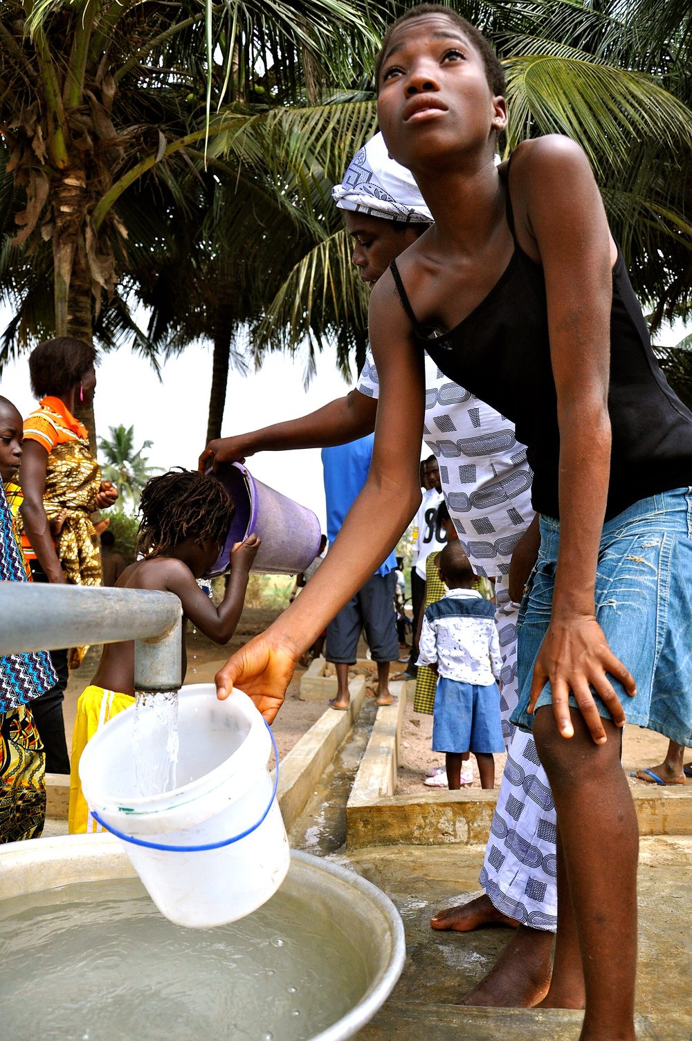 Villagers collecting safe water at a community hand pump